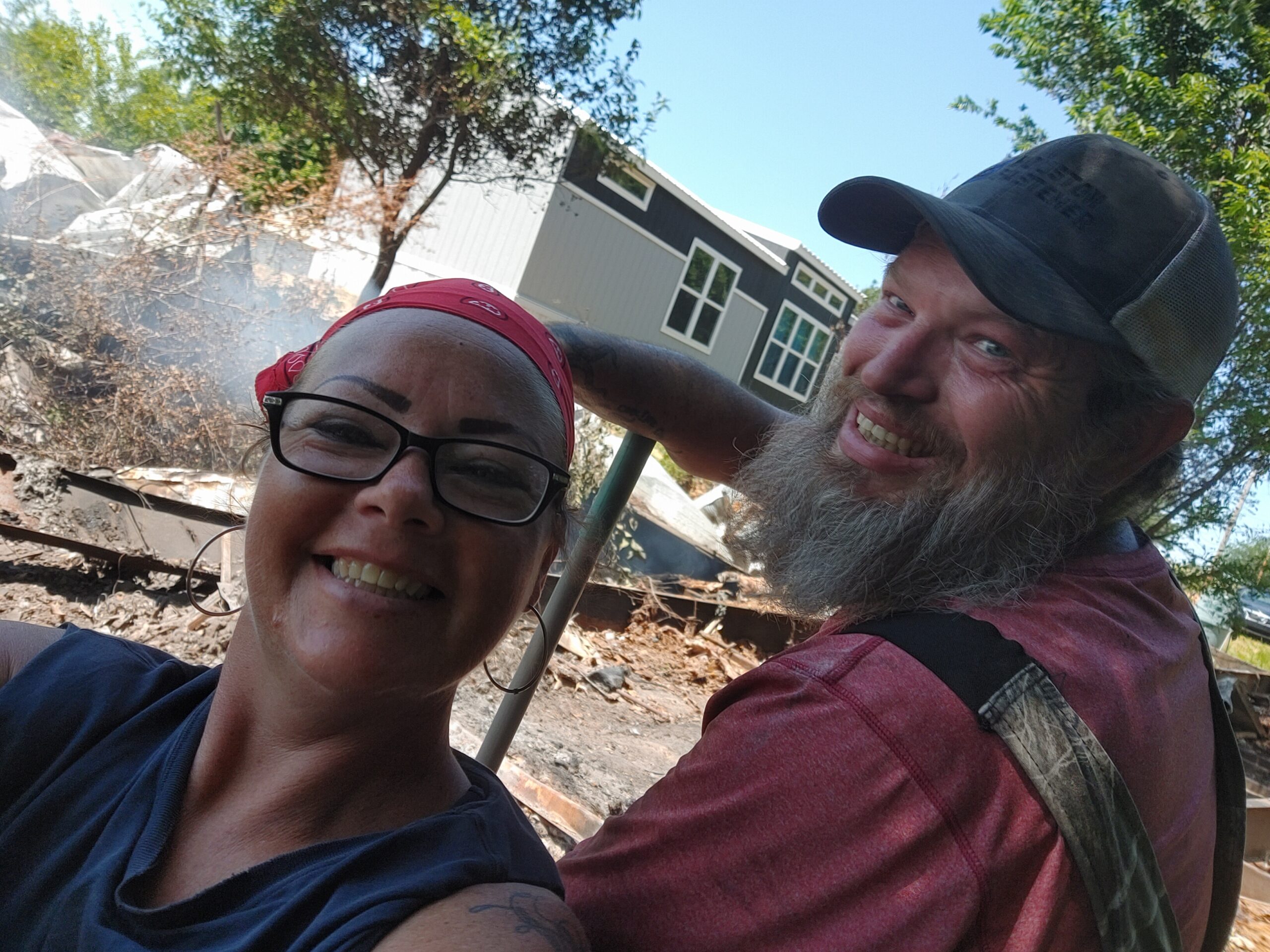 Bob & Jackie in front of our burning wreckage