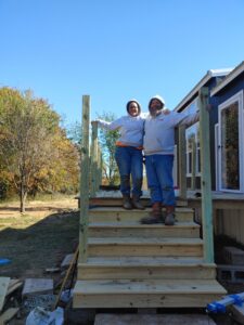 Bob & Jackie Standing on Deck on rental property