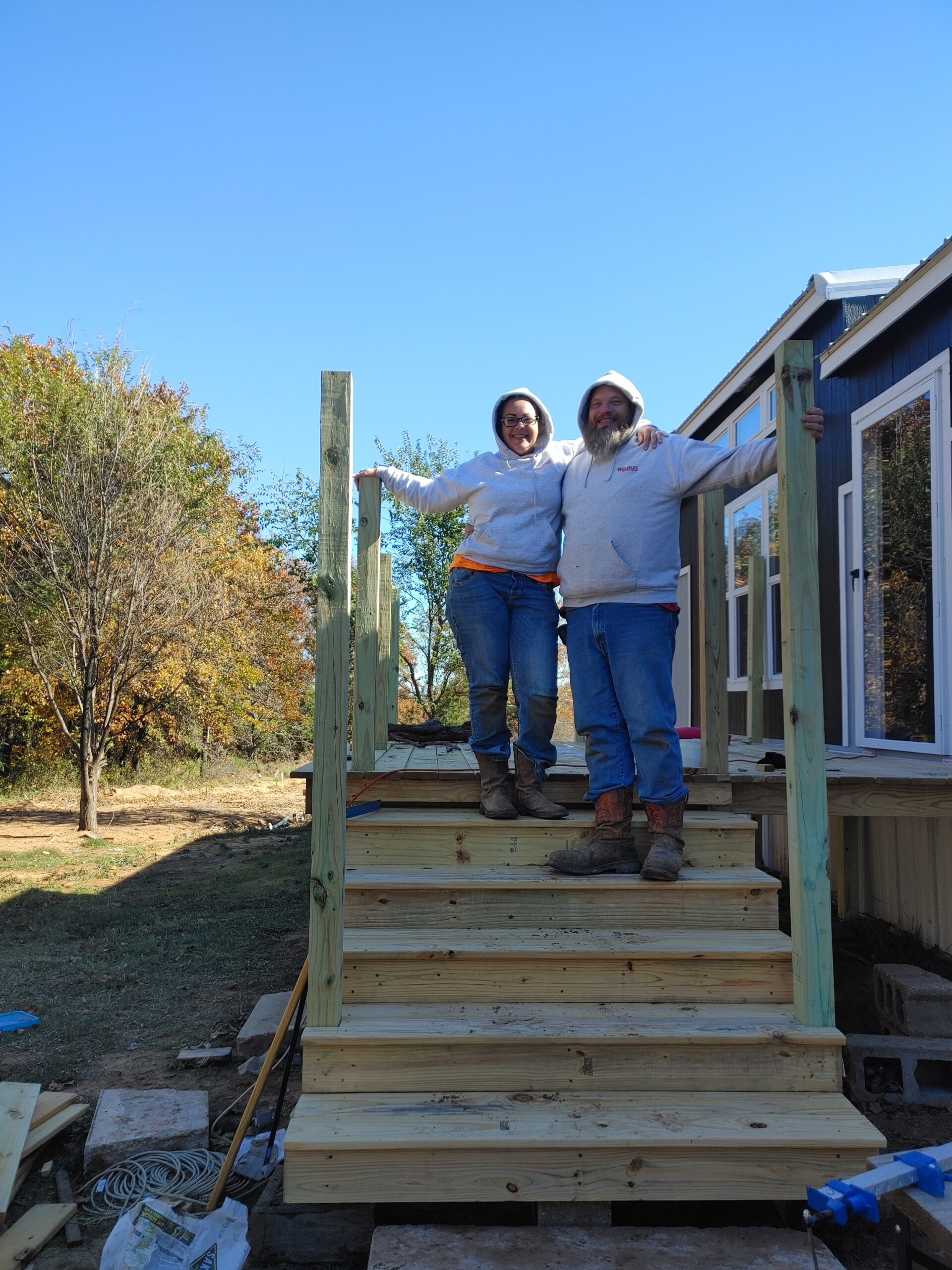 Bob & Jackie Standing on Deck on rental property