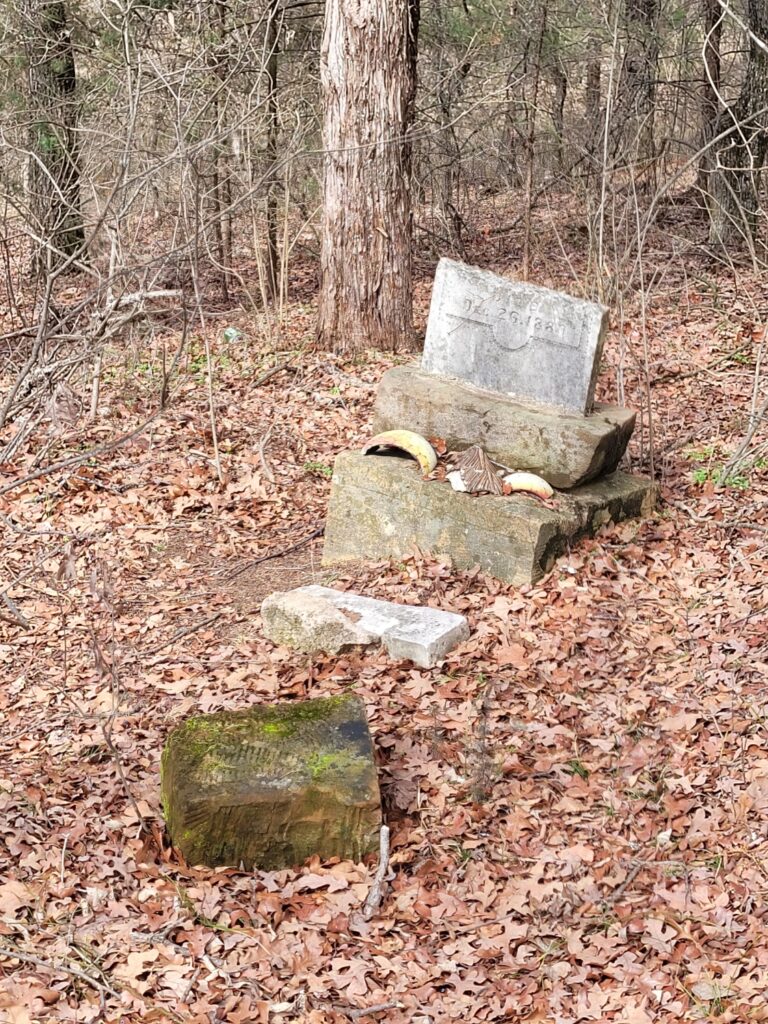 Gifts left on a tombstone in Brown Springs Cemetery located in Oklahoma